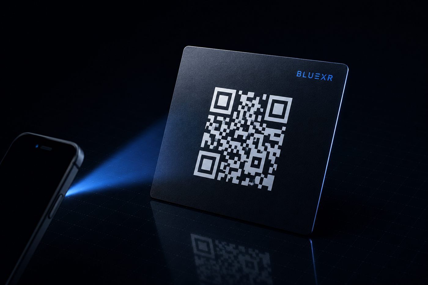 A printed BLUΞXR QR card being scanned by a phone.